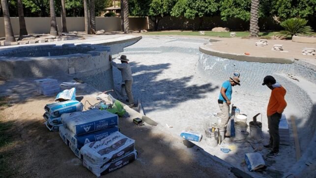 3 guys performing pool plastering in Mesa