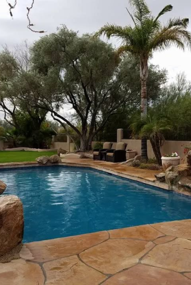 Attached image file Beautiful Pool with Large Stones on the corners by Tempe pool contractors